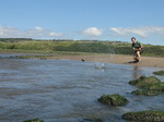 SX07941 Wouko skipping stone on Ogmore River.jpg